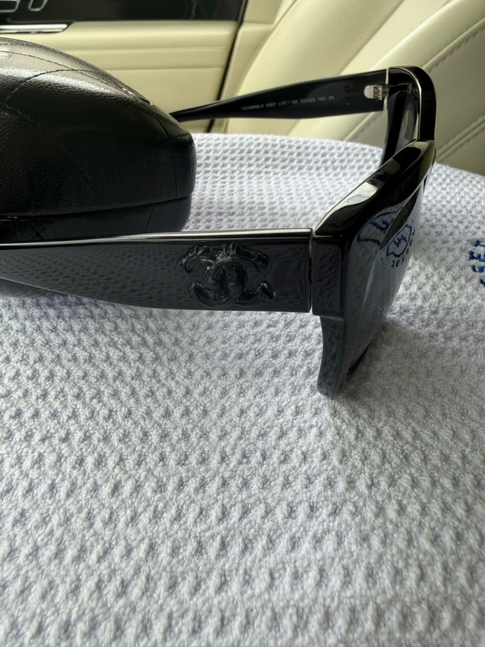 CHANEL Black Sunglasses with Silver Logo Accent